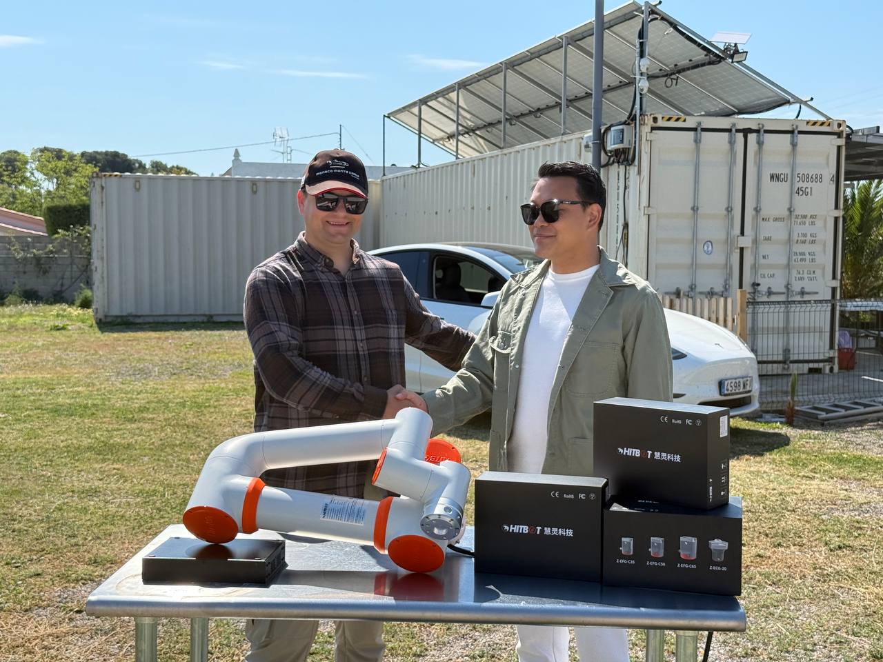 Robotics equipment and project participants in a supplied field photograph